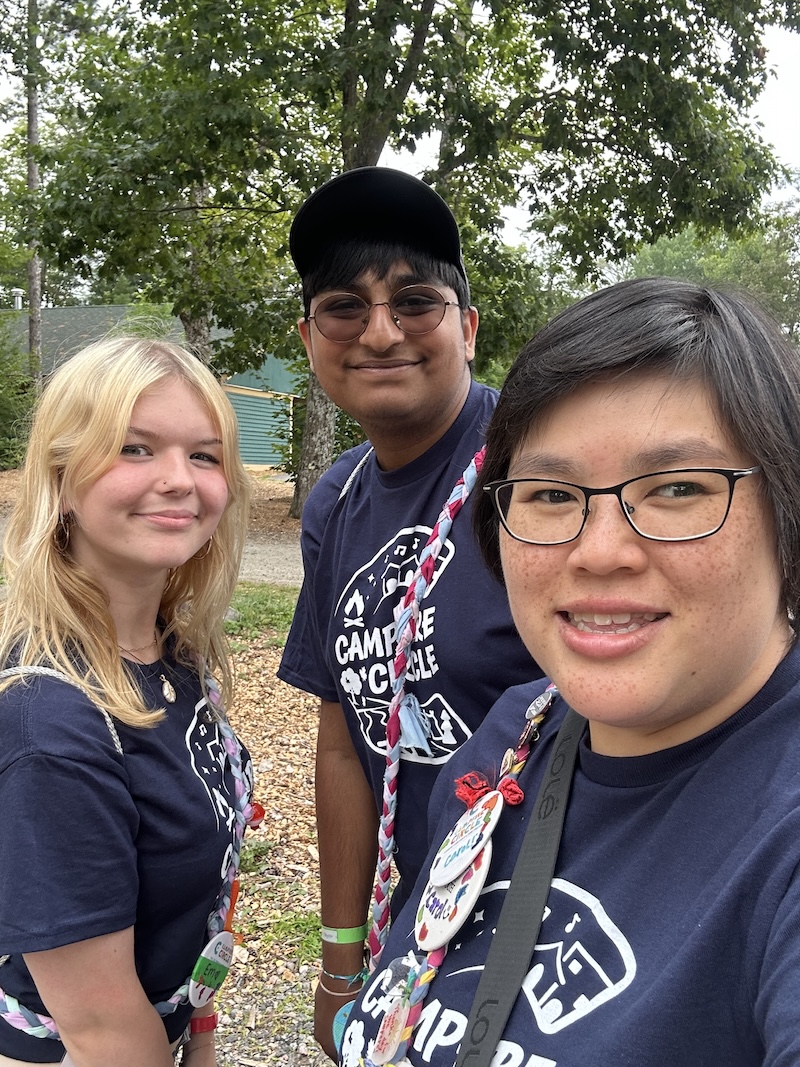 selfie with volunteers outside at camp