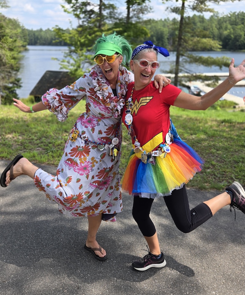 volunteers in costume on a sunny day outside at camp